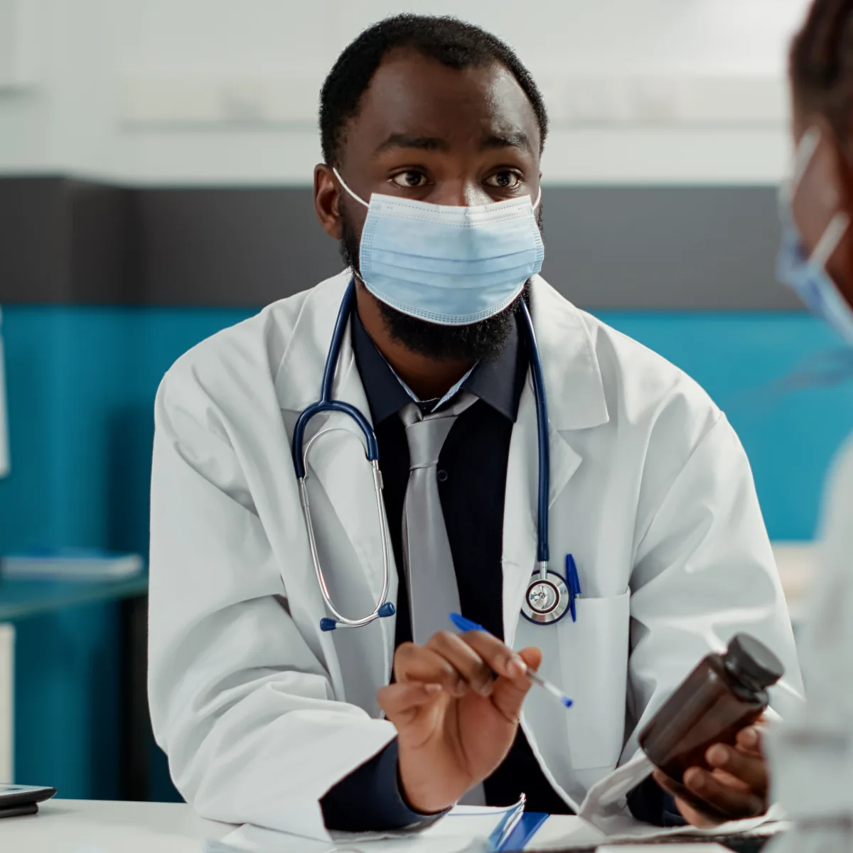 A doctor talking with a patient about her care